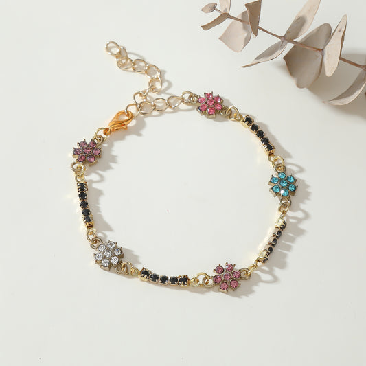 Elegant Gold Chain Bracelet with Multicolored Daisy Rhinestones & Black Accents - Chic Statement Jewelry for Women, Perfect for Everyday Wear or Special Occasions