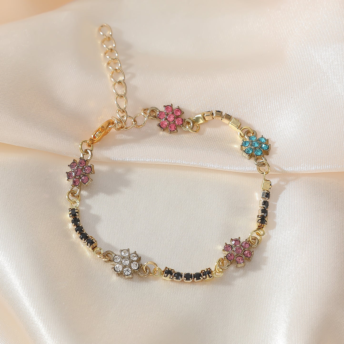 Elegant Gold Chain Bracelet with Multicolored Daisy Rhinestones & Black Accents - Chic Statement Jewelry for Women, Perfect for Everyday Wear or Special Occasions