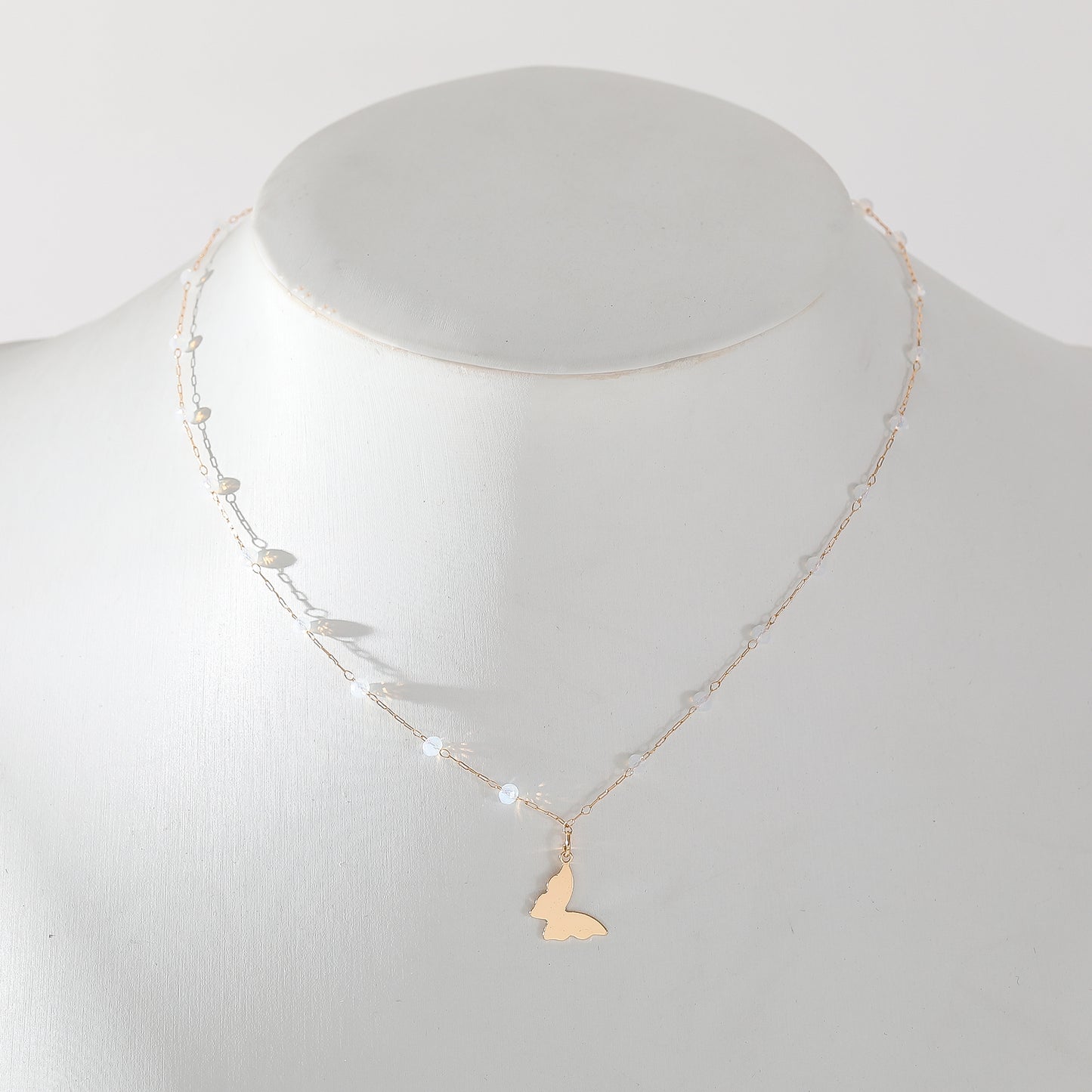 Delicate Gold Chain Necklace with Assorted Faceted Beads & Gold Butterfly Dangle - Elegant and Versatile Jewelry for Women