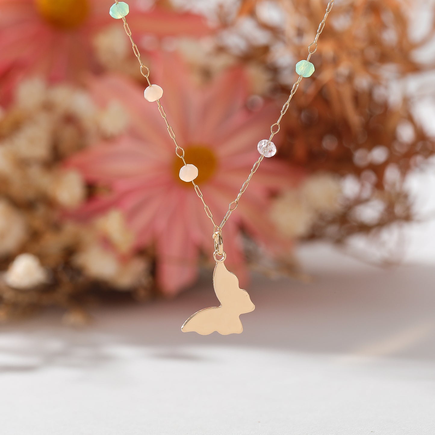 Delicate Gold Chain Necklace with Assorted Faceted Beads & Gold Butterfly Dangle - Elegant and Versatile Jewelry for Women