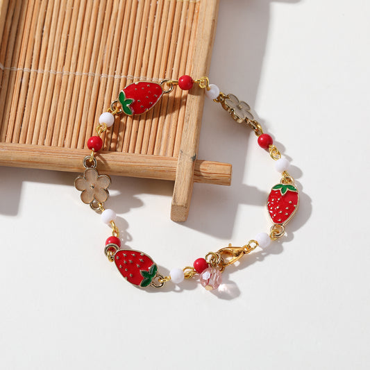 Gold Strawberry & Flower Charm Bracelet - Whimsical and Elegant Jewelry for Women