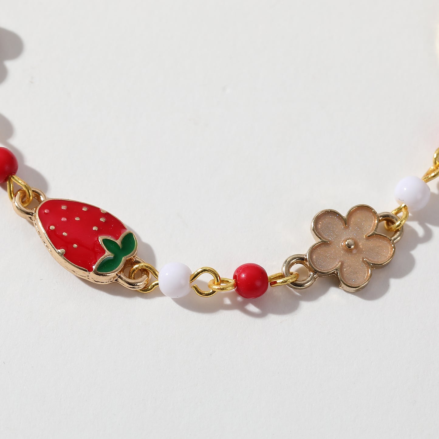 Gold Strawberry & Flower Charm Bracelet - Whimsical and Elegant Jewelry for Women